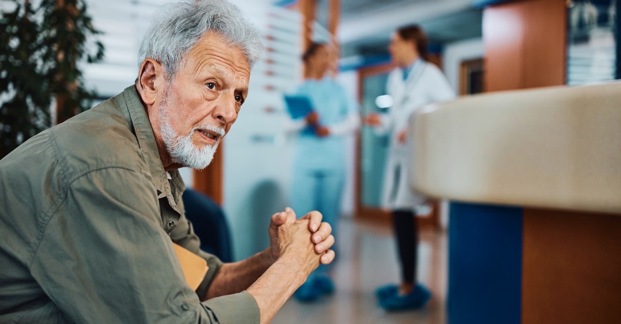 Man in a hospital looking anxious