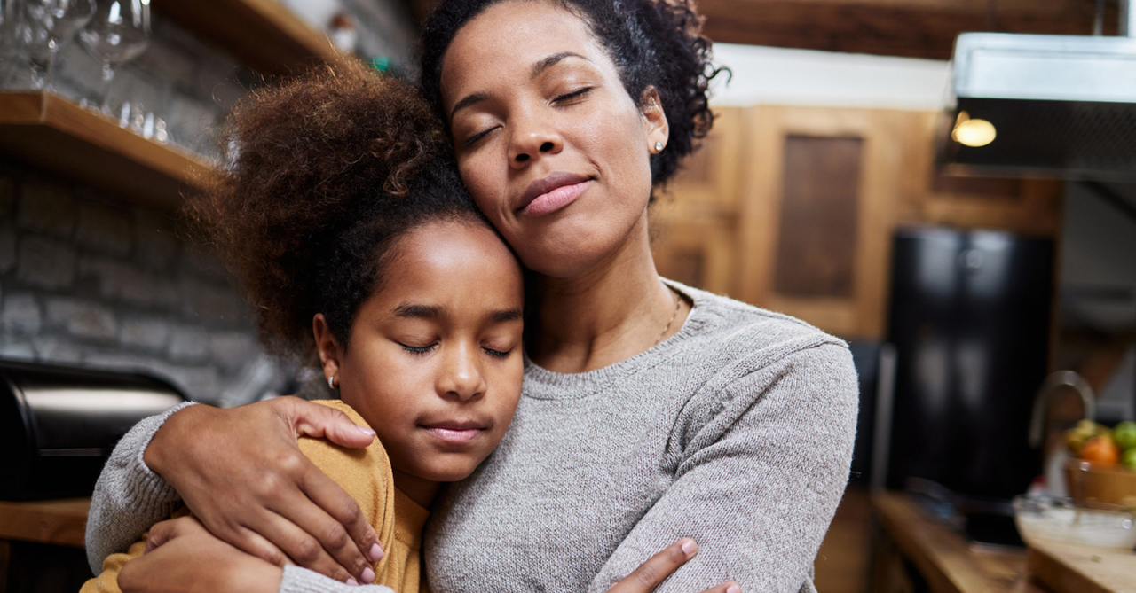 Mom comforting her daughter; how to teach children about God's love in hard times.