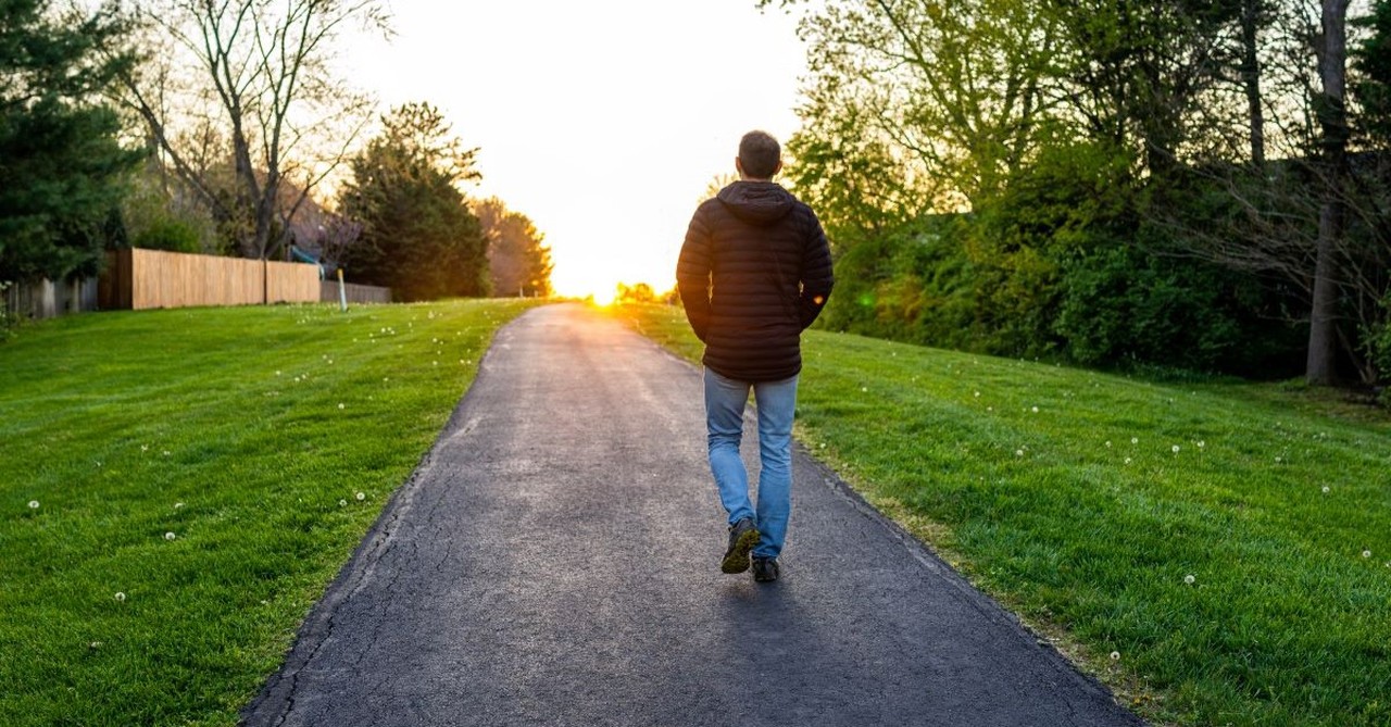 Man talking a morning walk at sunrise