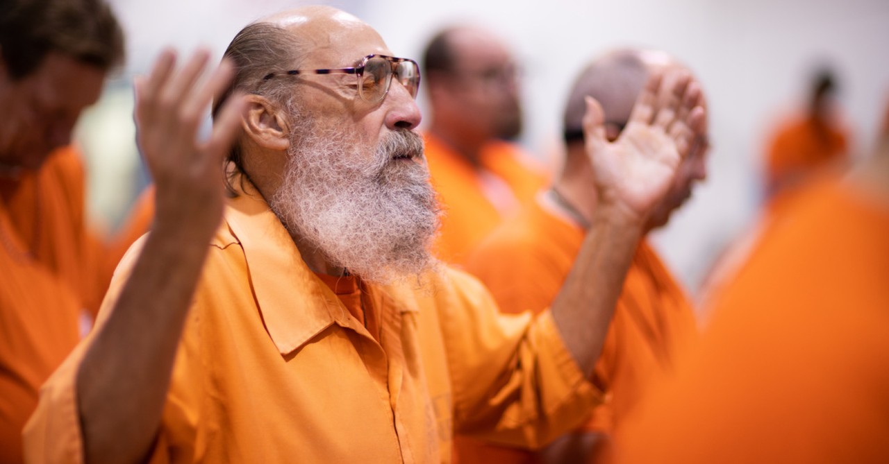 men worshipping with a prison ministry, TBN releases new documentary on prison ministries
