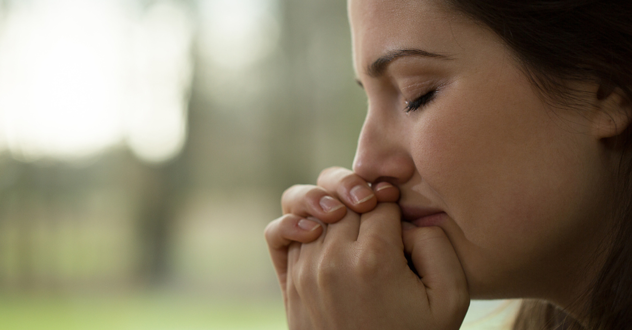 Overwhelmed mom praying