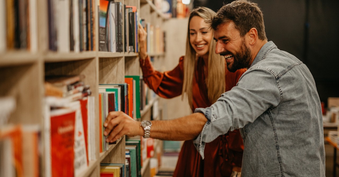 Happy couple on date at bookstore