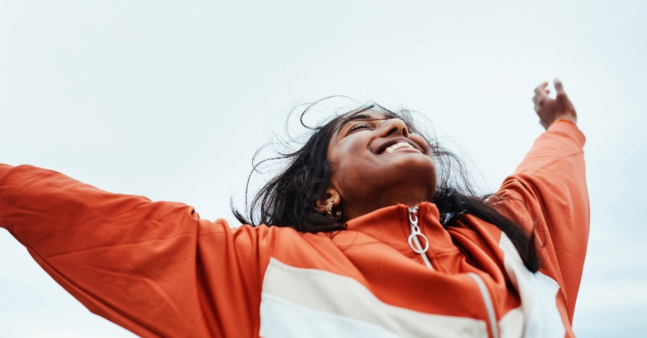 Woman holding her hands up to the sky