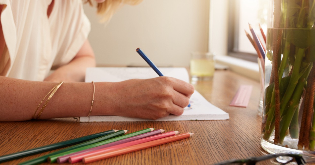 woman coloring book pencils