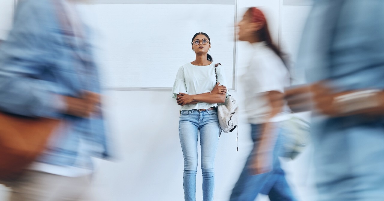 Student, anxiety and woman in busy college campus