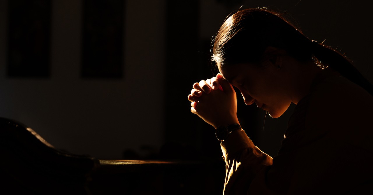 woman praying at night  time