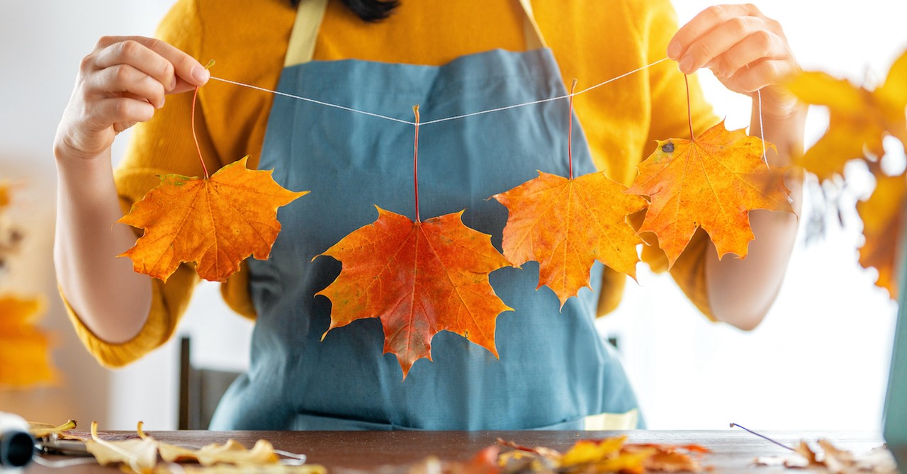 Woman doing fall craft with leaves