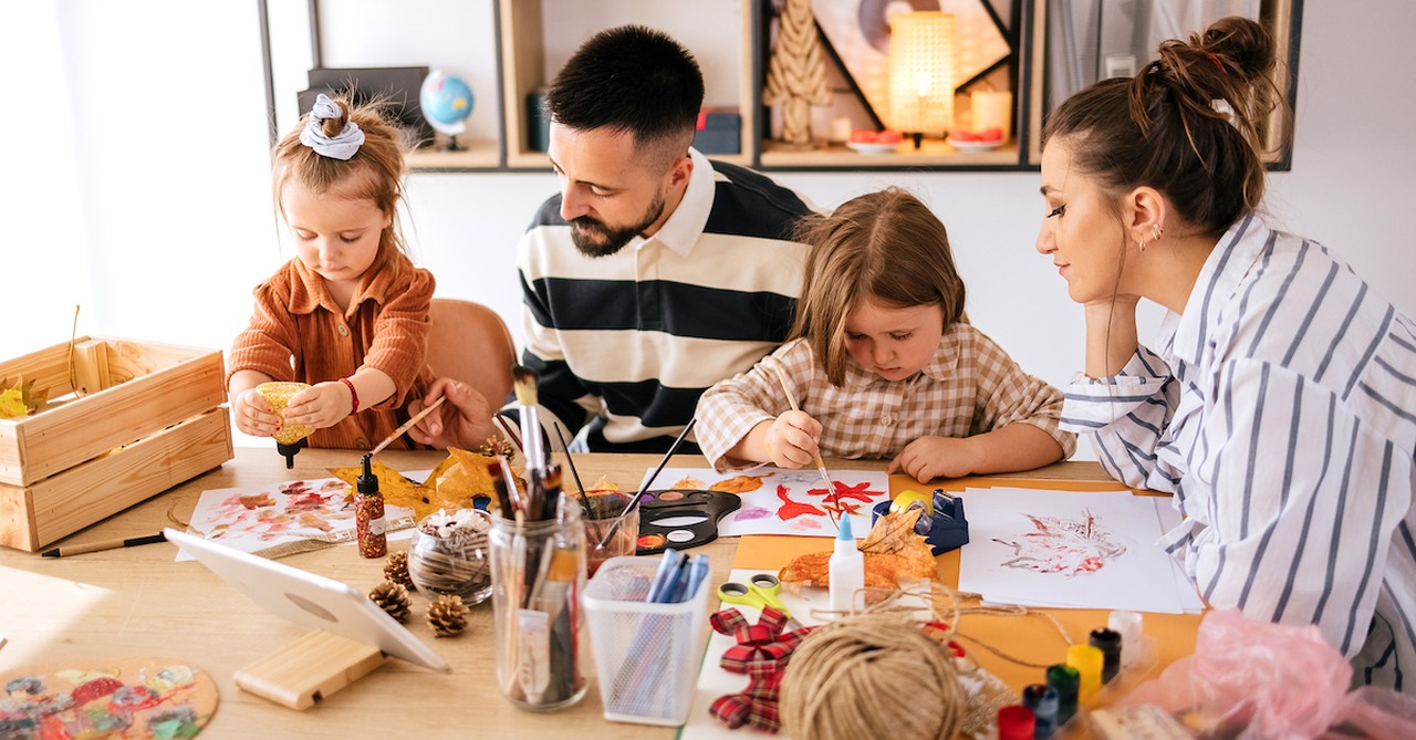 Family doing fall craft with kids