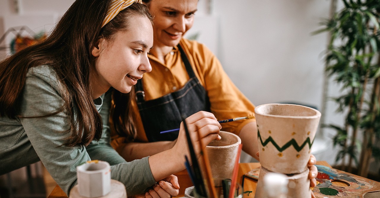 Mom and teen daughter painting craft