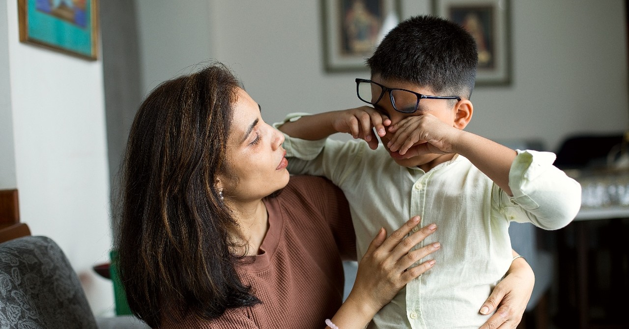 Woman comforting her son