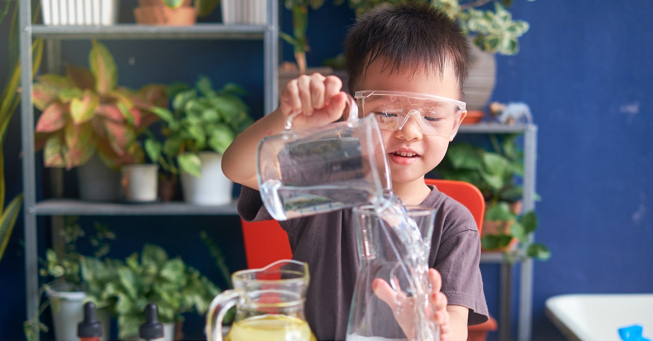 Young kid doing homeschool science experiment