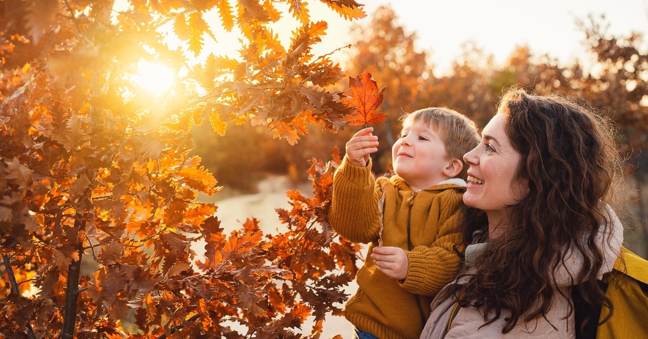 Woman with son and fall leaves