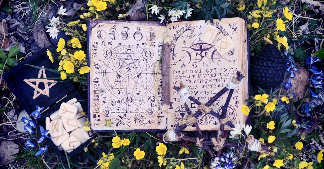 Occult diary surrounded by flowers