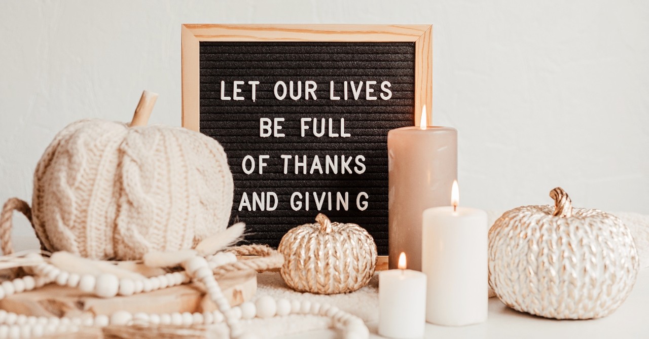 White pumpkins and giving sign