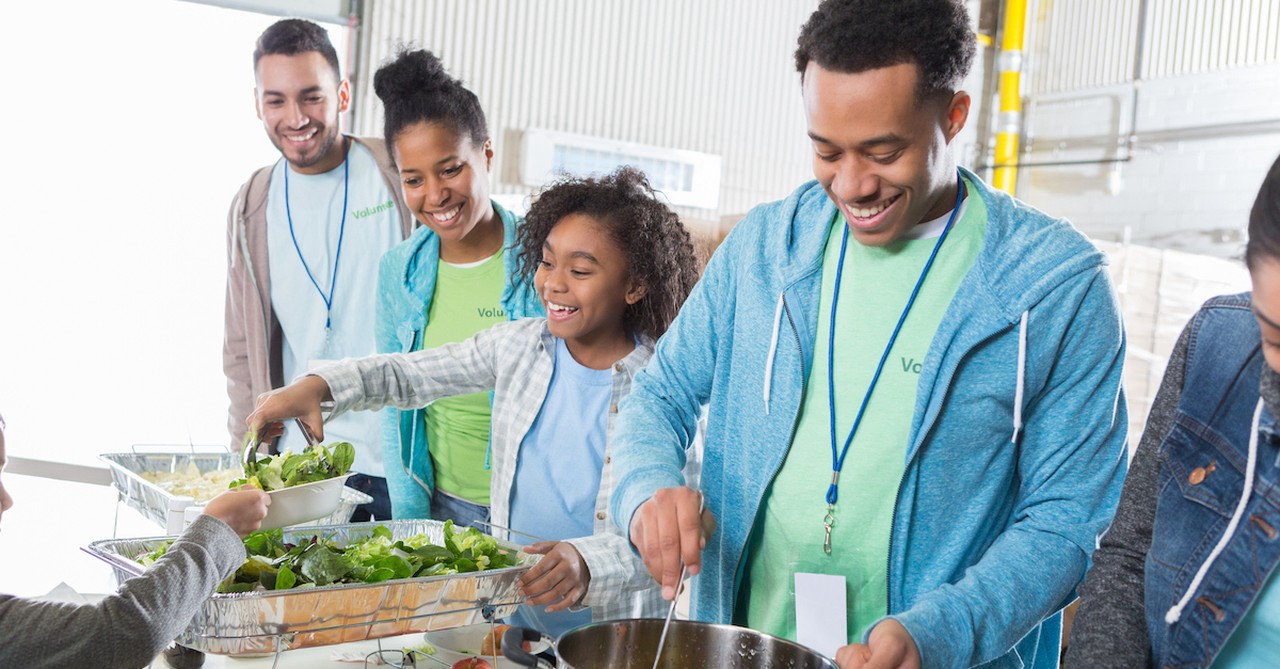 Family volunteering in food kitchen