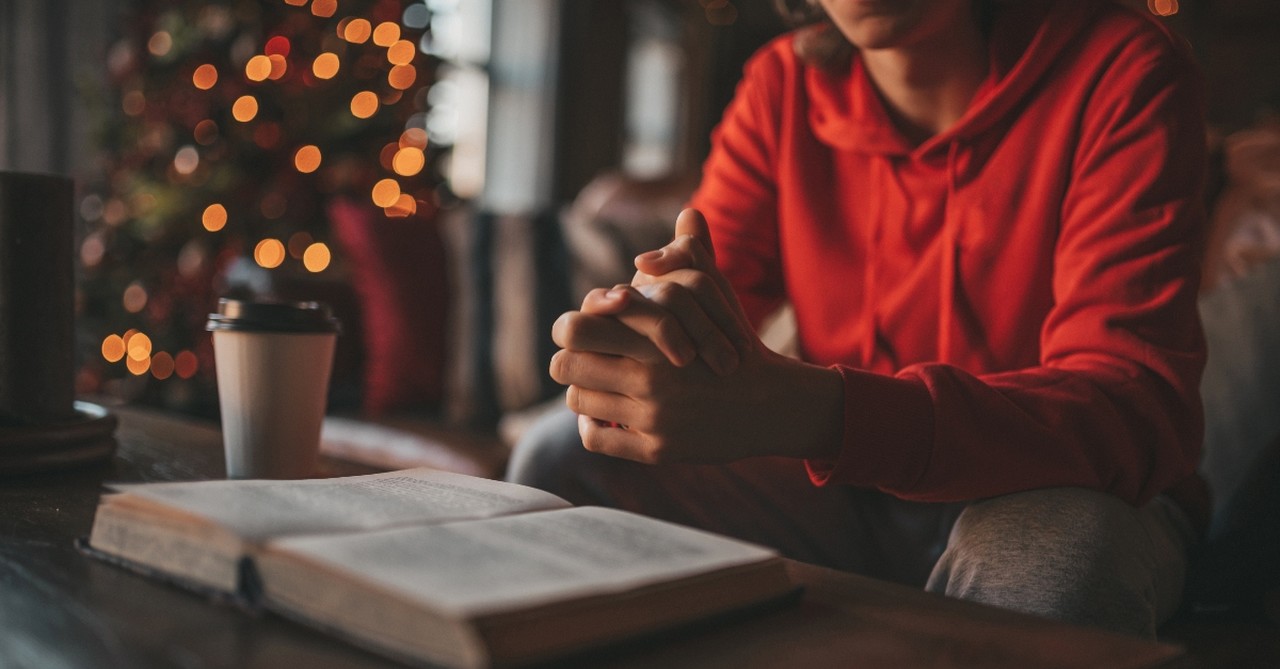 Woman reading her Bible at Christmas