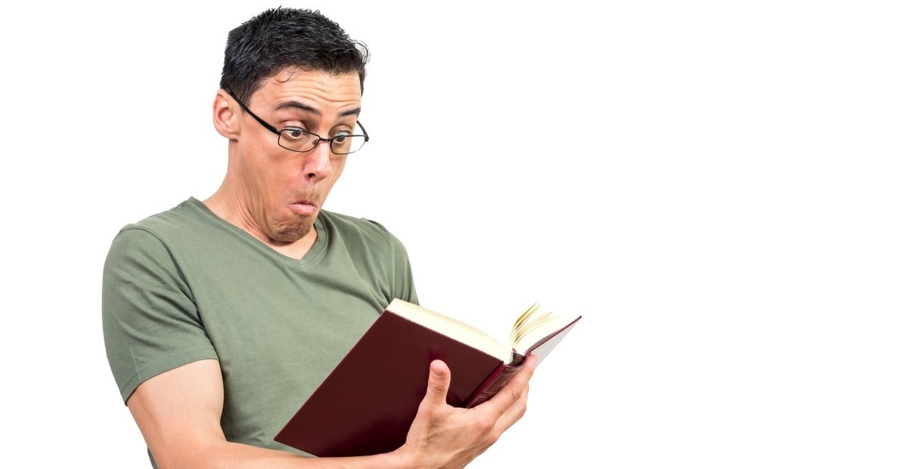 man wearing glasses looking shocked as he reads bible, funny bible quotes