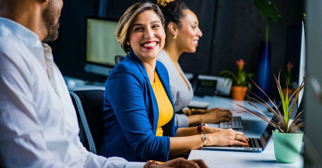 Woman smiling at a co-worker