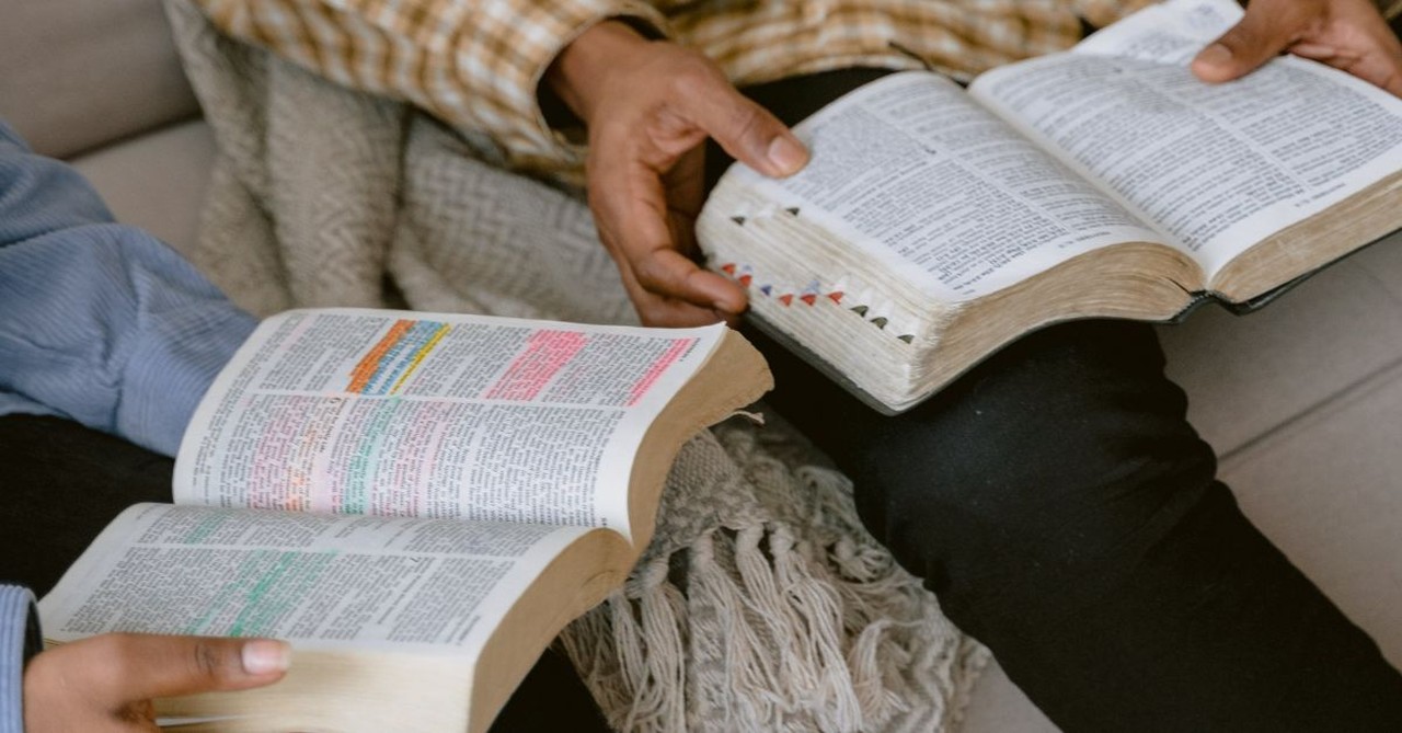 Two men studying the Bible together