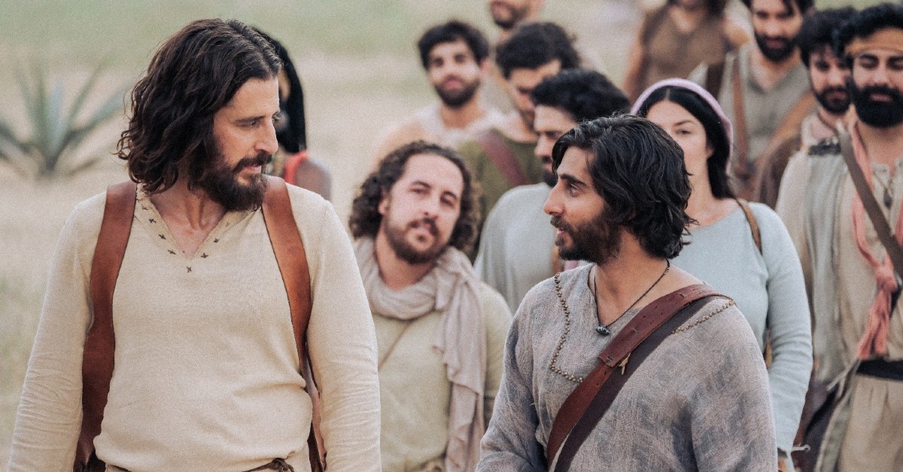 Jesus and Judas Iscariot converse while disciples walk behind them in a season 4 episode of The Chosen