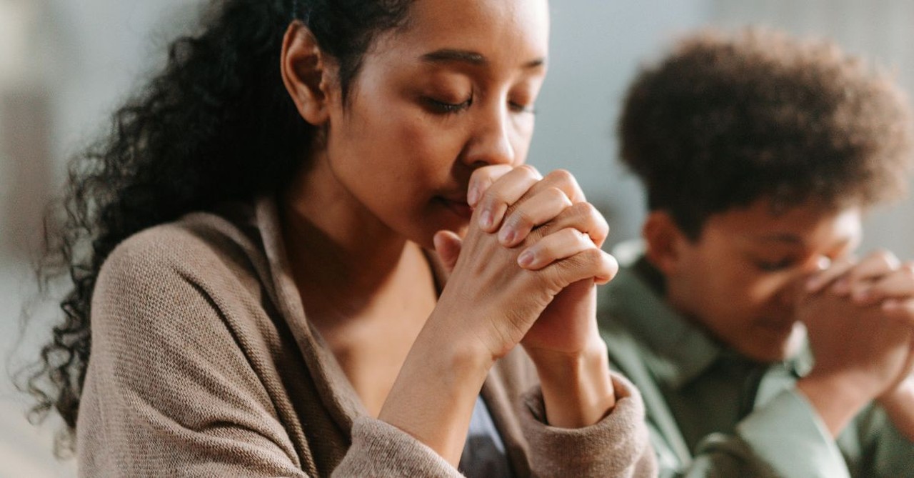 Mother and son praying