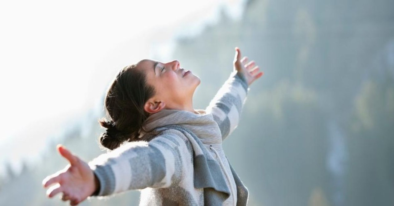 Woman in nature; surrender 