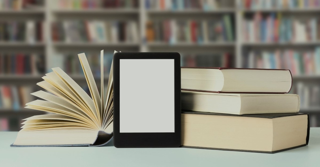 ebook tablet next to pile of books,  impact of technology on christian living and worship