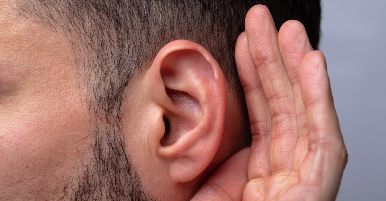 man holding hand up to ear, Prayers Your Husband Needs You to Pray for Him