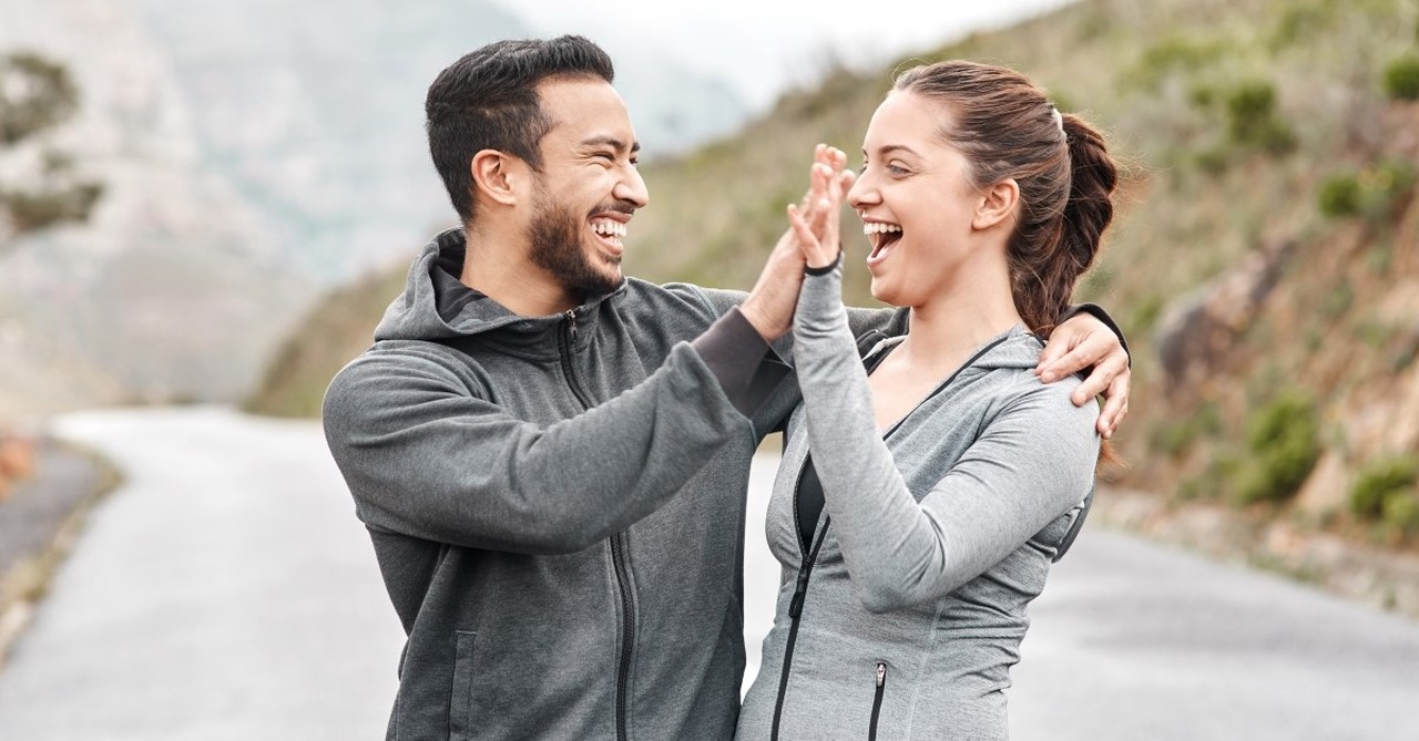 couple high-fiving each other, best pieces of marital advice I've ever heard