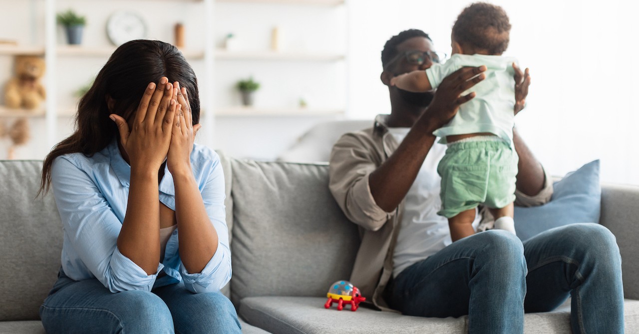 Mom and dad with baby guilt and stress as new parents