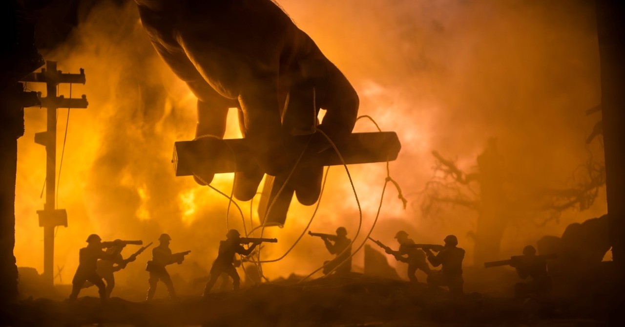 puppeteer's hands over battlefield to signify what the antichrist will look like