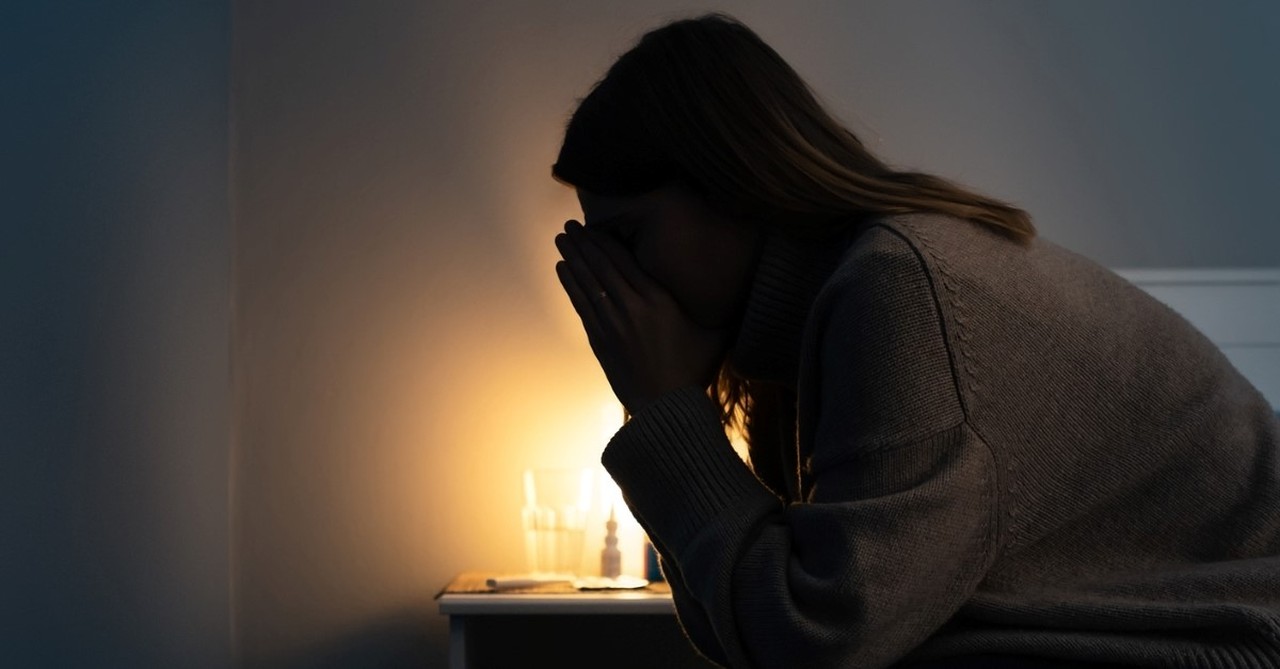 women in bed praying