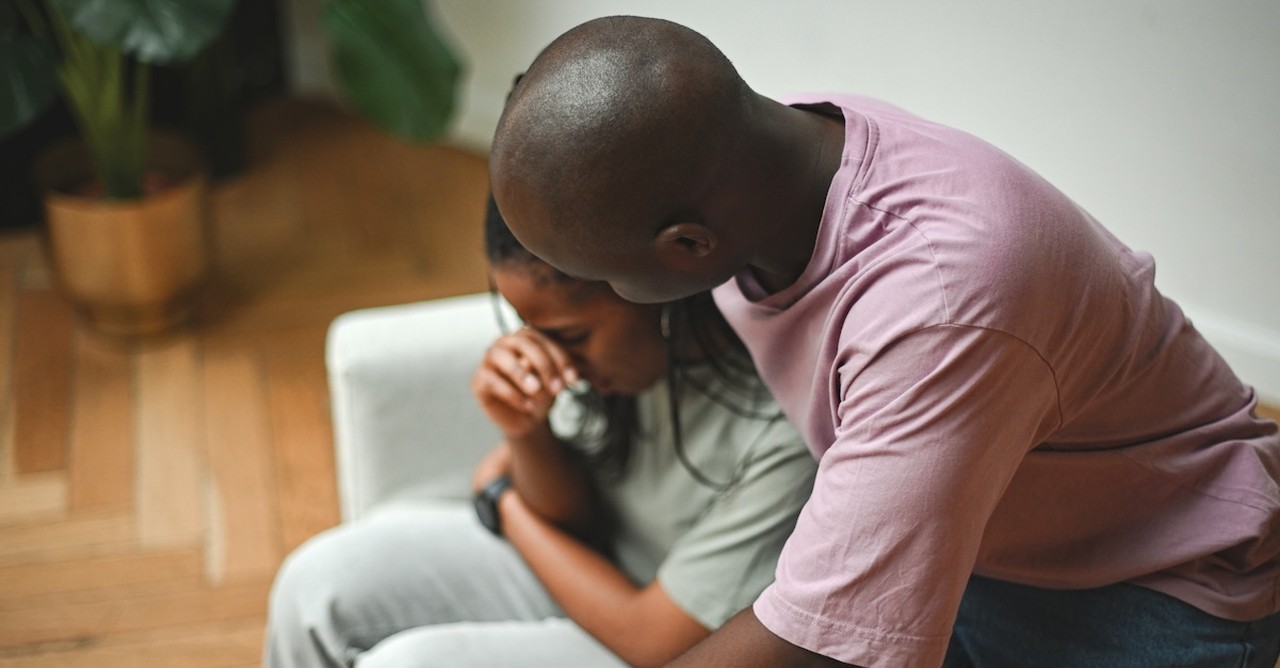 Husband comforting crying wife