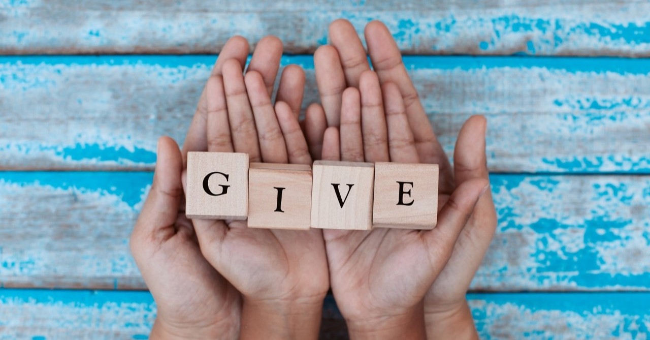 hands holding up woodblocks that say "give", things strong christian men do