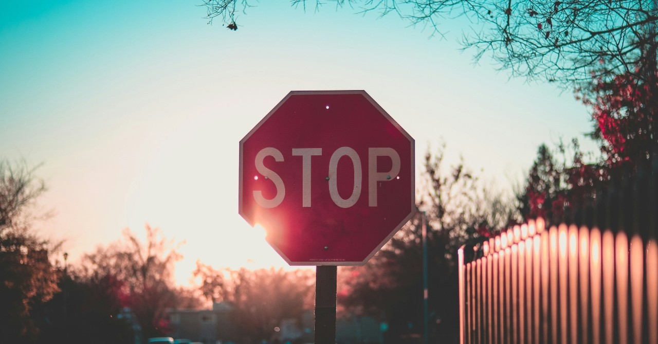 Stop sign at sunset