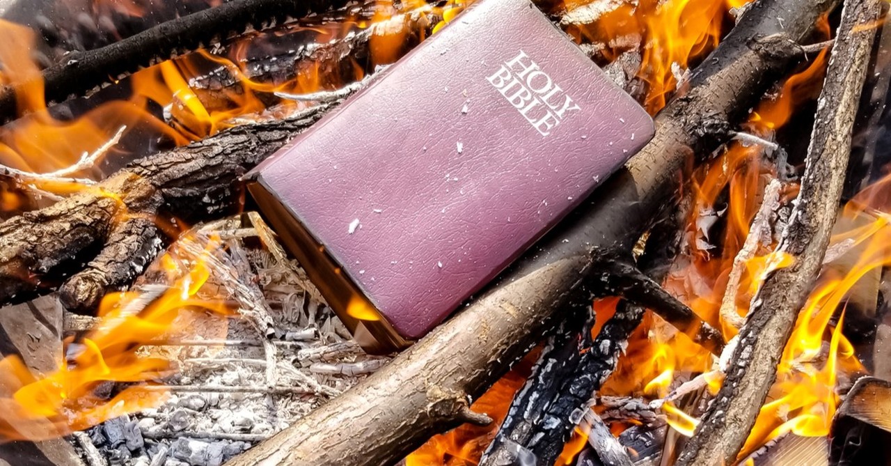 bible being burned in campfire pit, ways to spot false prophets