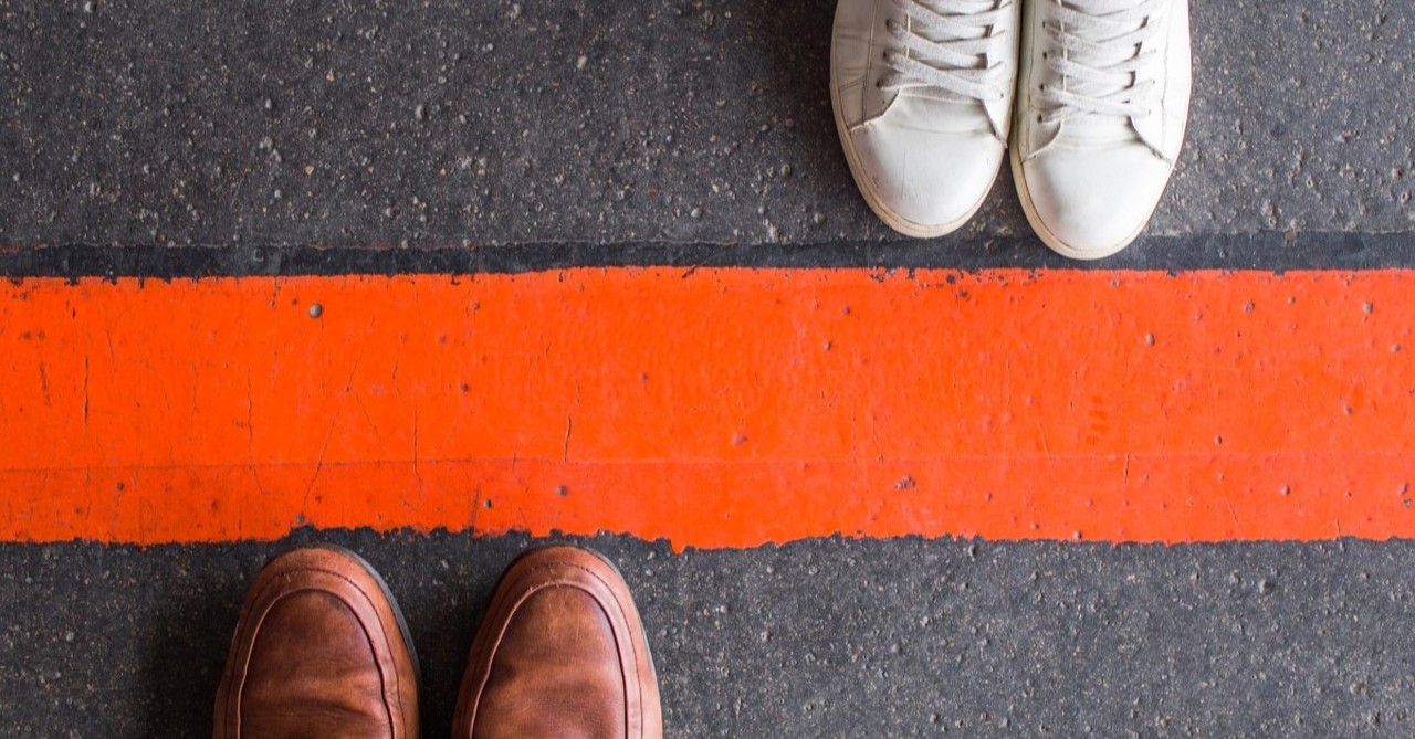 shoes on different sides of a line to demonstrate healthy boundaries