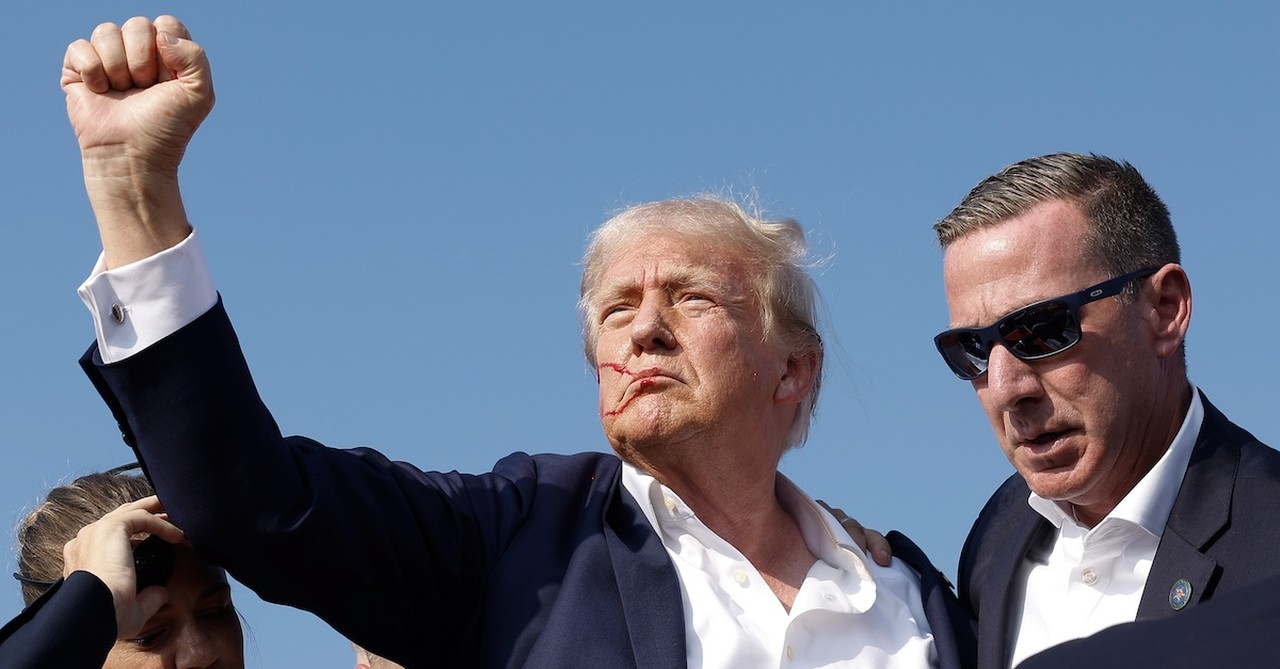 Trump with his fist in the air after surviving assassination attempt at rally in PA