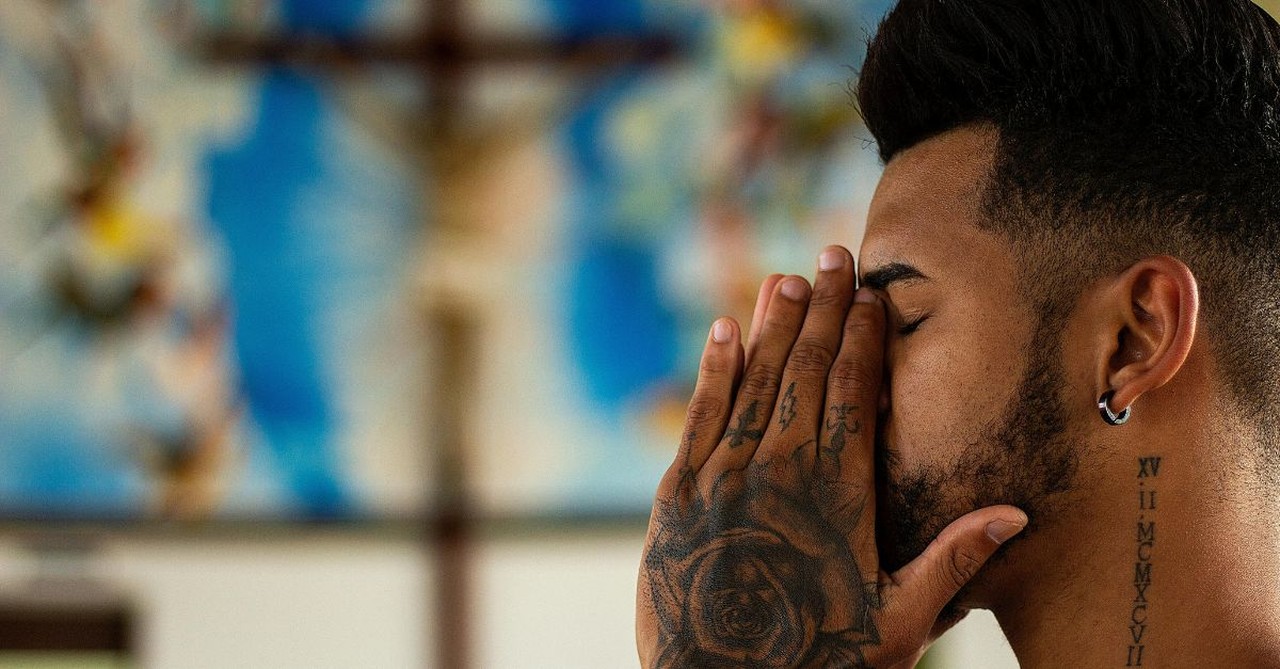 Man Praying in Church