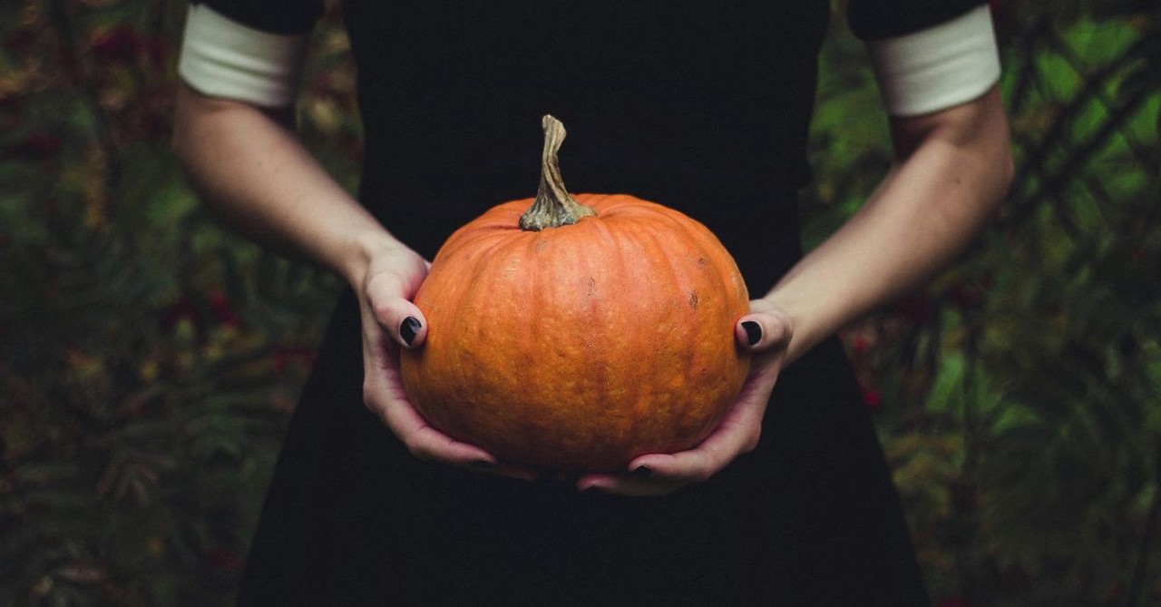 Woman Holding a Pumpkin; Can a holiday like Halloween be used to spread the Gospel?