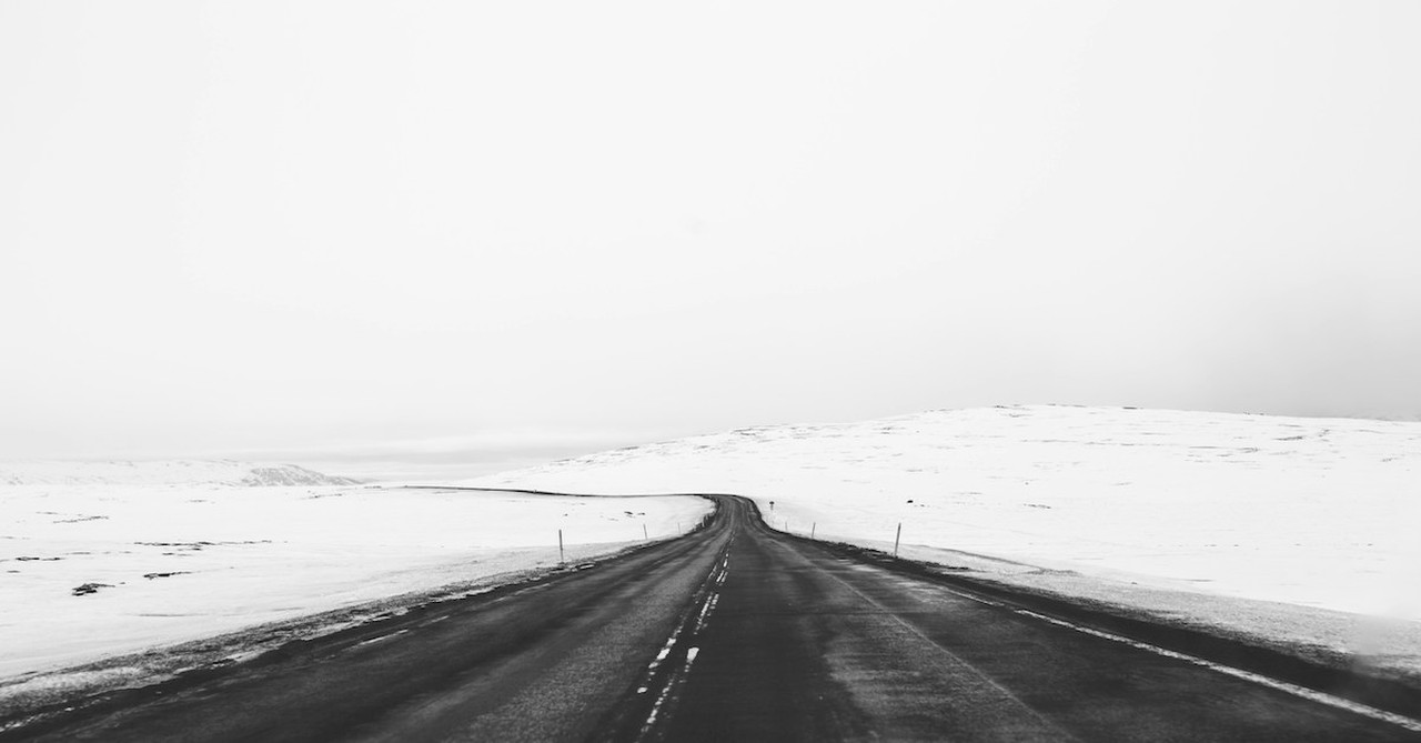 black and white road with snow