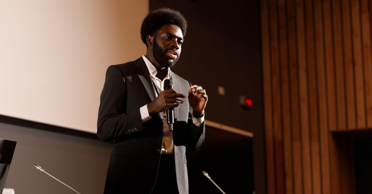 young man announcing; speaking; speaker