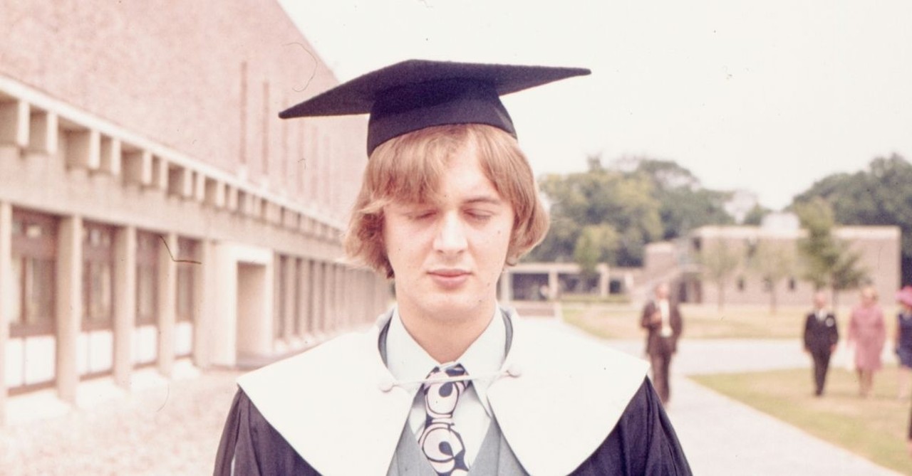 Male Graduate, Eyes Closed with Cap and Gown On; how do I know what God wants me to do after graduation, and what is discernment?