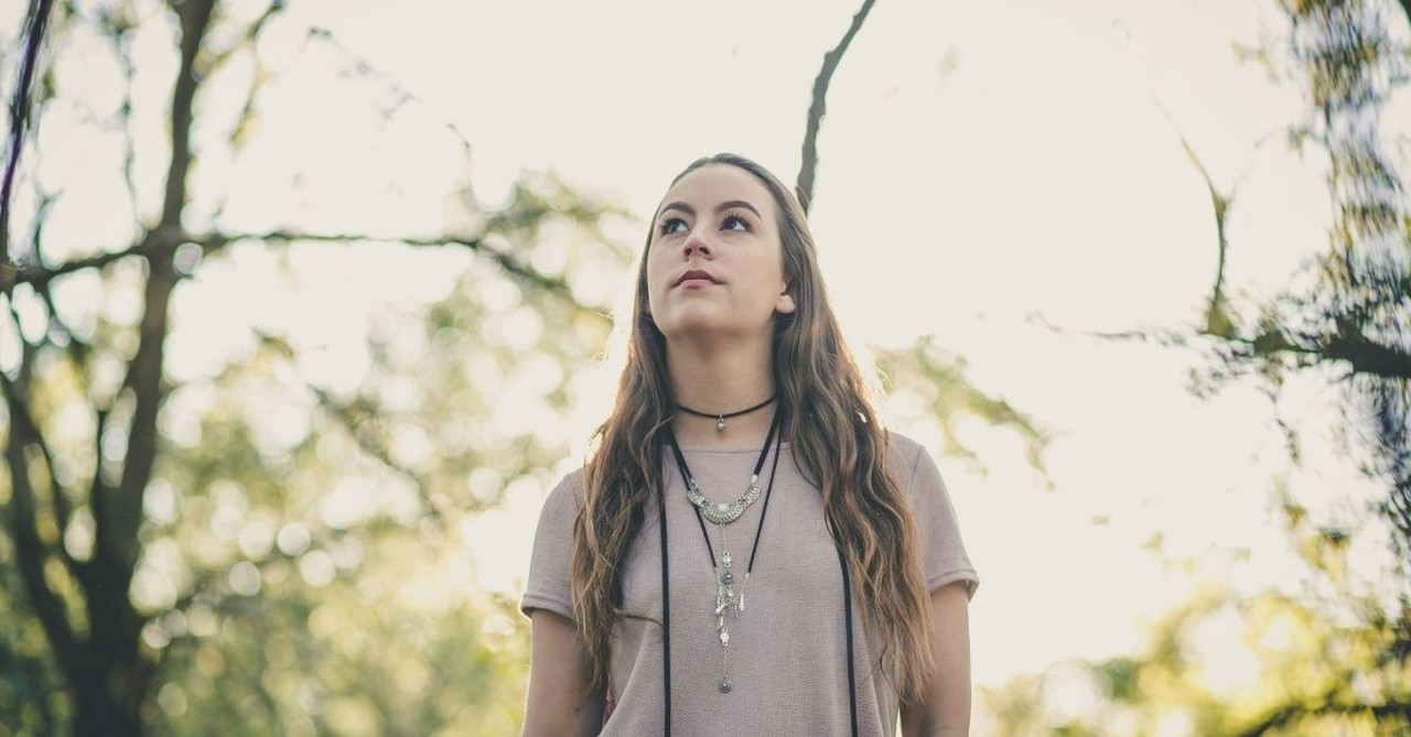 Woman Walking in the Woods, looking up