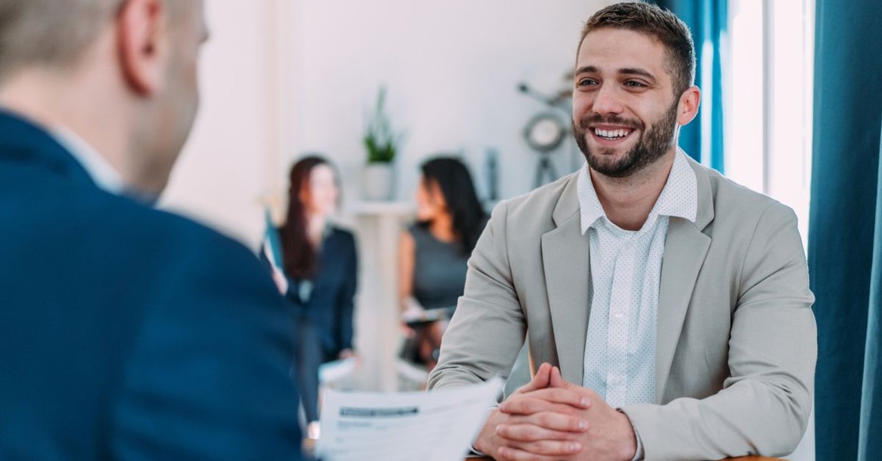 Man during job interview; resume