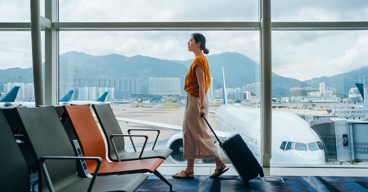 Woman in airport traveling flying