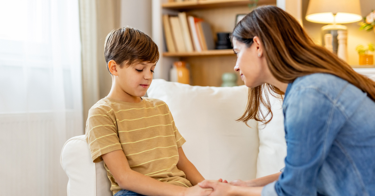 Parent listening carefully to child at home