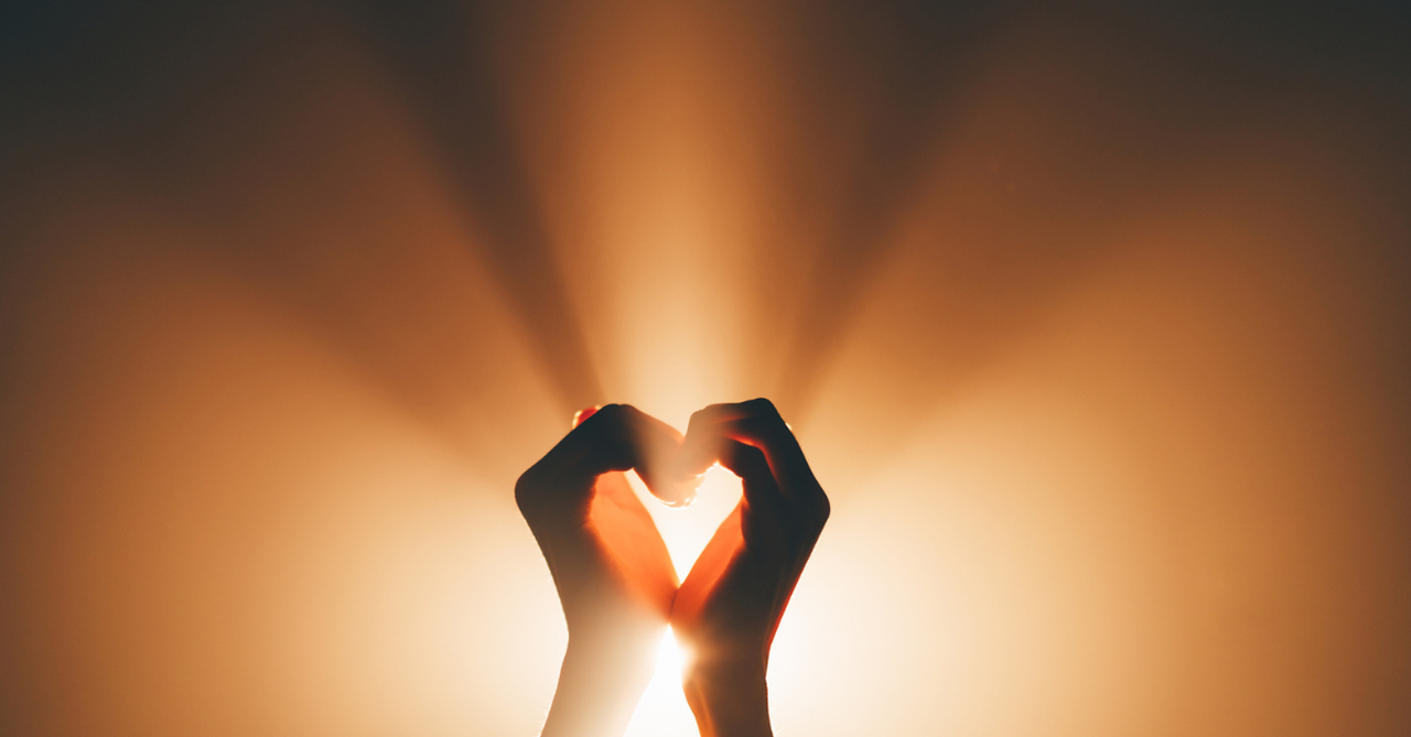 Hands lifted in prayer or open toward light