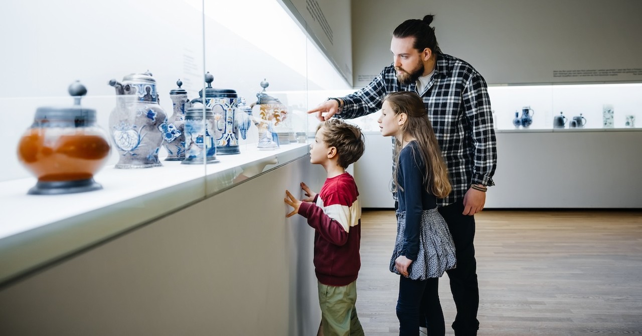Dad and kids at art museum activity