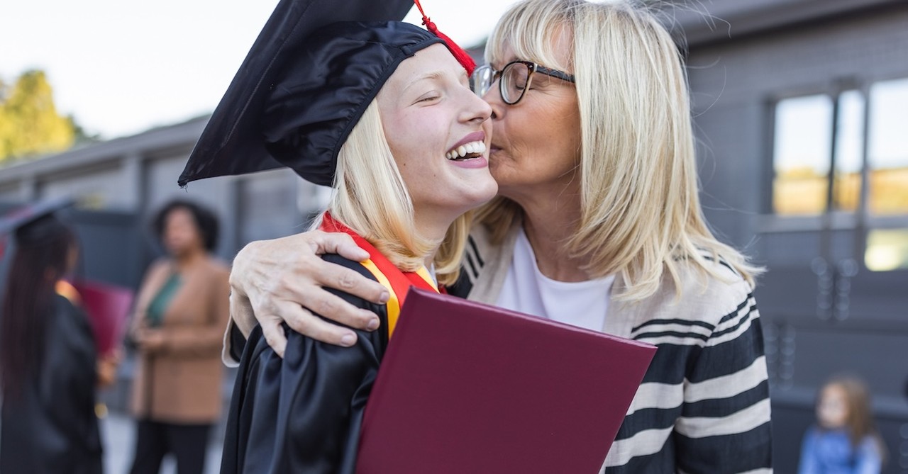 Mom proud of teen daughter graduation graduating celebrating